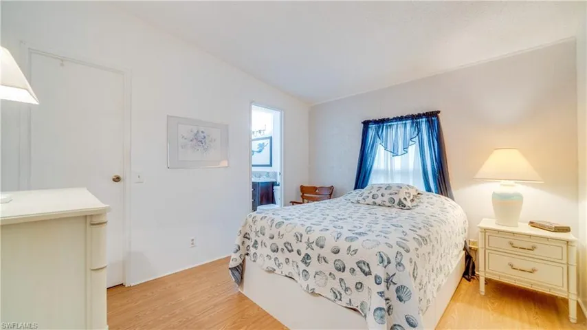 The guest bath has been stylishly updated and connects to the guest bedroom.