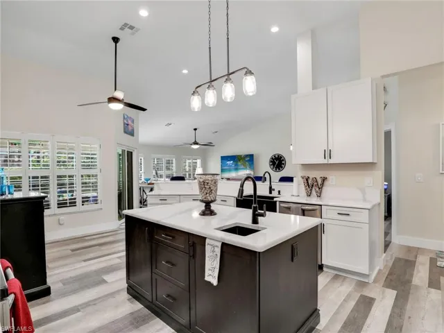 Kitchen offers custom light fixtures for a modern feel