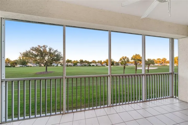 Unfurnished sunroom with view of golf course and plenty of natural light