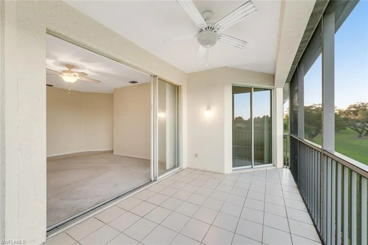 Unfurnished sunroom with a ceiling fan
