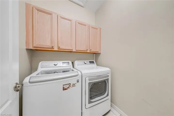 Laundry room with cabinet space and independent washer and dryer