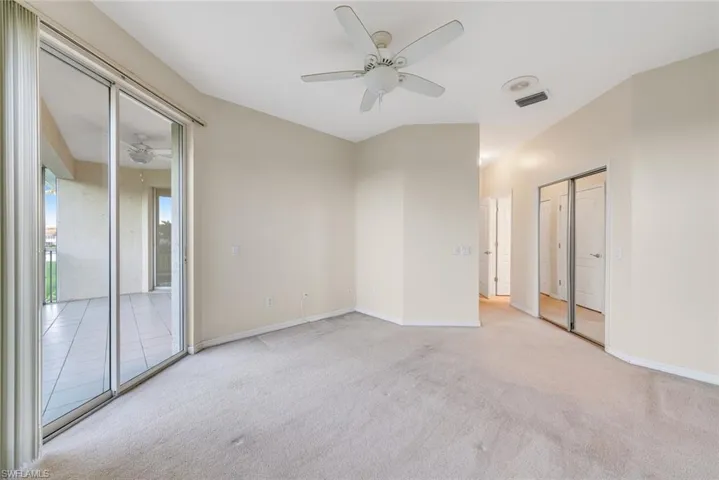 Unfurnished bedroom with carpet flooring, a ceiling fan, and access to outside