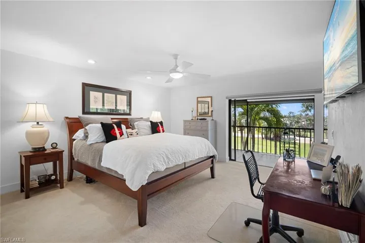 Bedroom featuring access to outside, carpet flooring, multiple windows, a ceiling fan, and recessed lighting