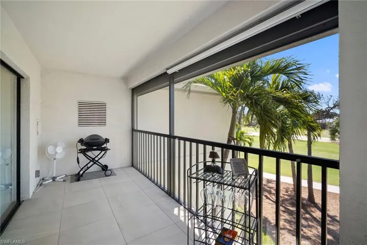 Balcony featuring a sunroom