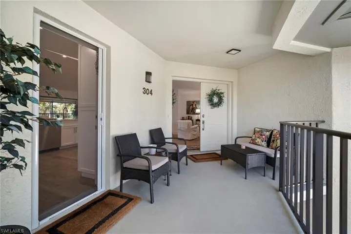 Property entrance featuring stucco siding