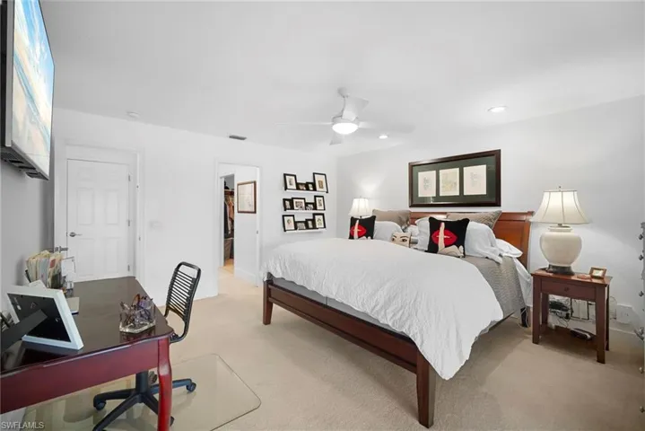 Bedroom featuring an office area, carpet floors, a ceiling fan, and recessed lighting