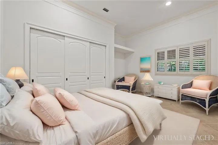 Guest bedroom #2 with large closet, crown molding & Plantation Shutters w/ Virtual Staging