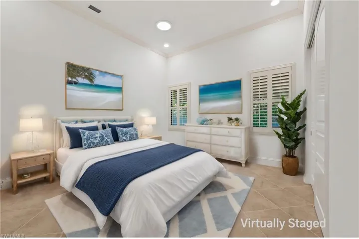 uest bedroom #3 featuring large closet, Planation Shutters, & crown molding w/ Virtual Staging
