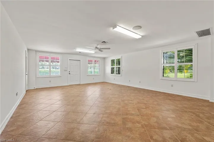 1200 sq. ft. Guest Quarters Living Room with tiled  floors., Impact windows and Plantation Shutters