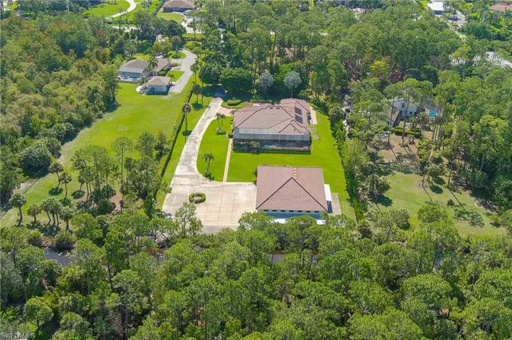Ariel view of property surrounded by Pine Trees