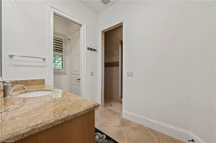 Guest bathroom #3/Pool Bath with Walk-in Shower and access to Screened pool/waterfall