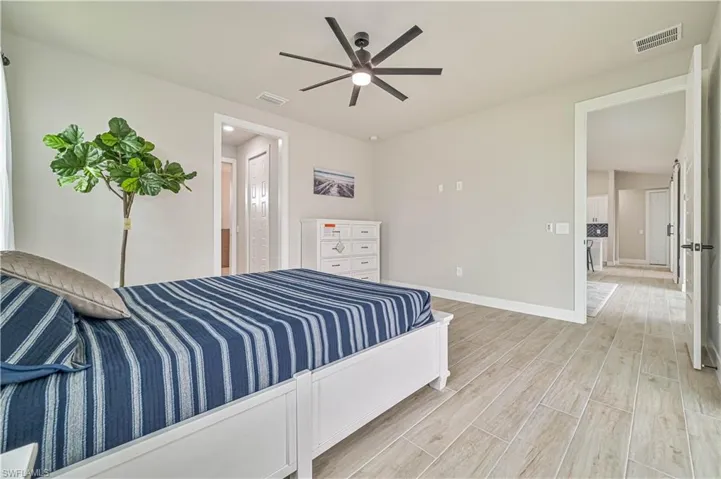 Bedroom with light wood-type flooring and ceiling fan