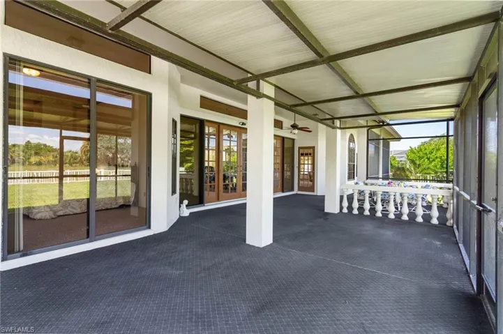 Bedroom with multiple windows and carpet floors