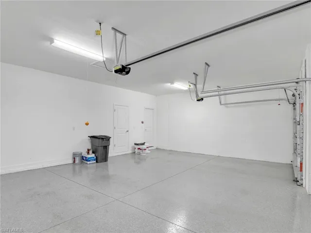 Garage featuring a garage door opener