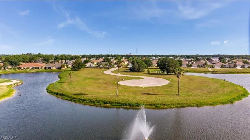 Birds eye view of property featuring a residential view and a water view