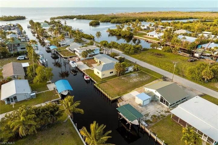Aerial view of residential area featuring a large body of water