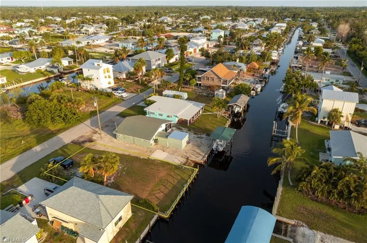 Aerial perspective of suburban area featuring a large body of water