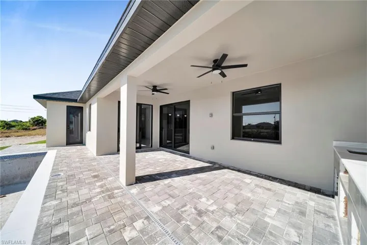 View of patio featuring a ceiling fan