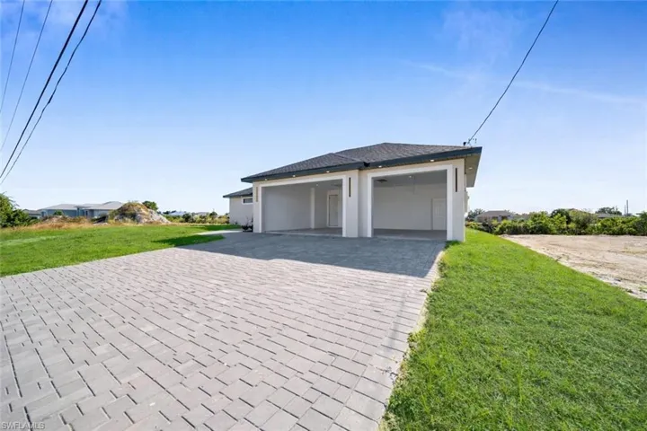 Garage featuring driveway