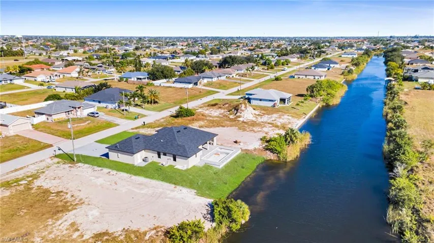 Aerial view of residential area with a large body of water