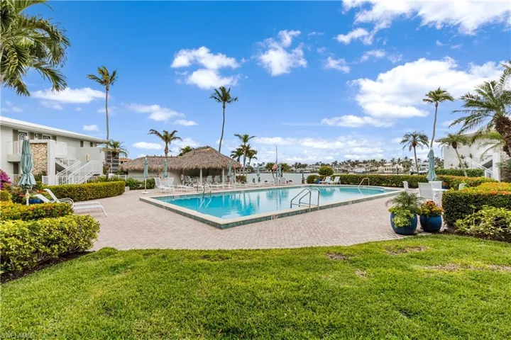 Community pool located on the bayside.  Cabana and docks in background near the bay.