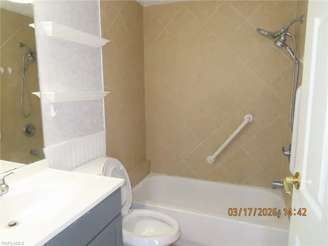 Bathroom with shower / bathtub combination and vanity