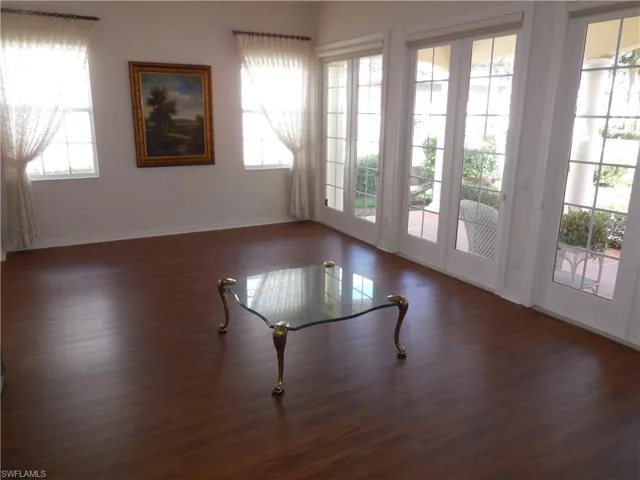 Empty room with wood finished floors and baseboards