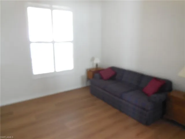 Living area featuring wood finished floors