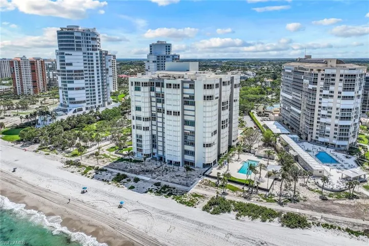 View of urban area featuring a pool area and a large body of water