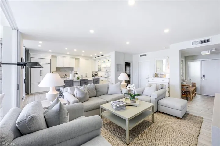 Living area featuring light wood-style flooring and recessed lighting