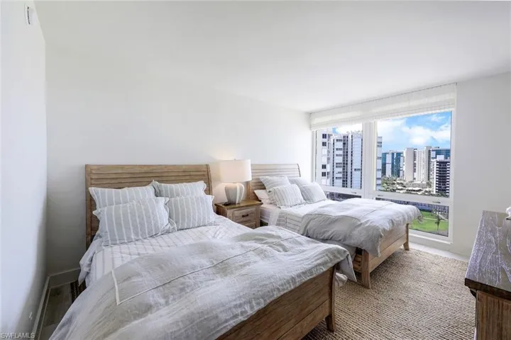 Bedroom with a view of city