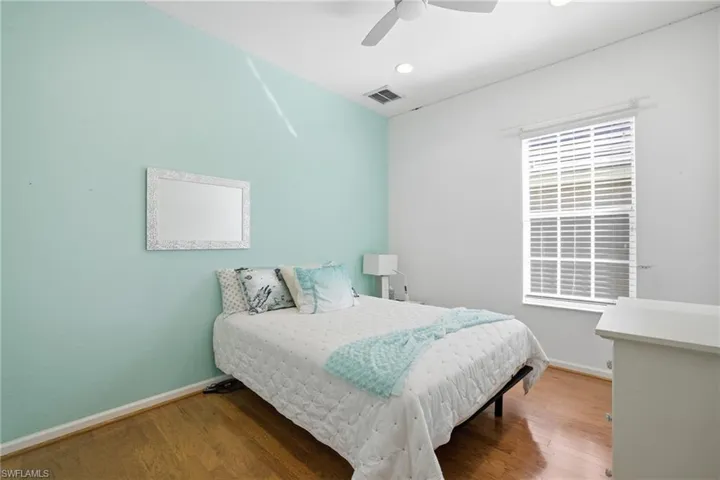 Bedroom featuring wood finished floors and ceiling fan