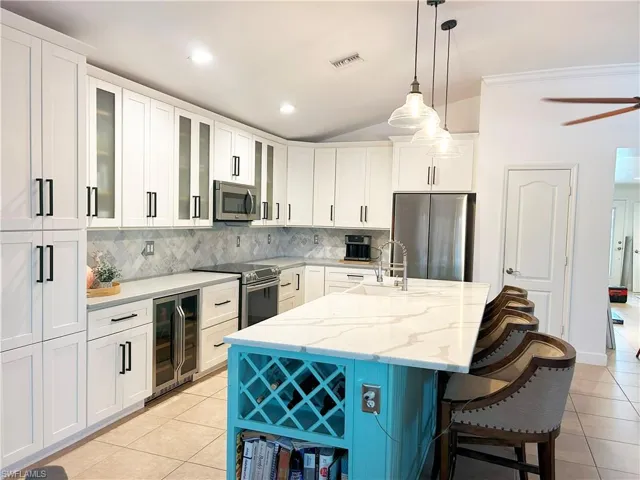 pendant lighting, vaulted ceilings & wine rack