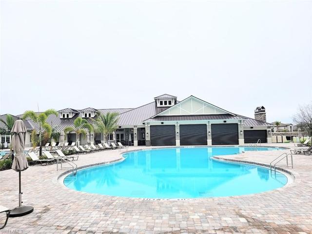 Resort-Style Pool & Restaurant w/Outdoor Restaurant in Foreground