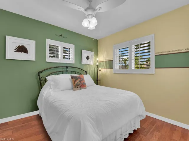 Bedroom featuring hardwood / wood-style floors and ceiling fan