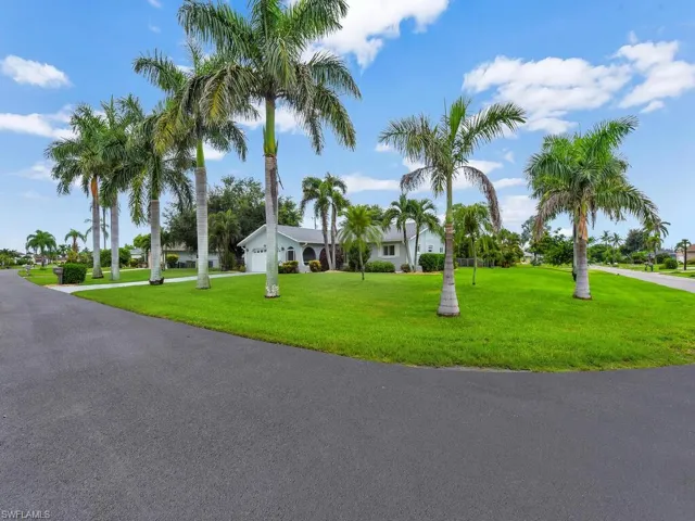 View of front of property featuring a front lawn