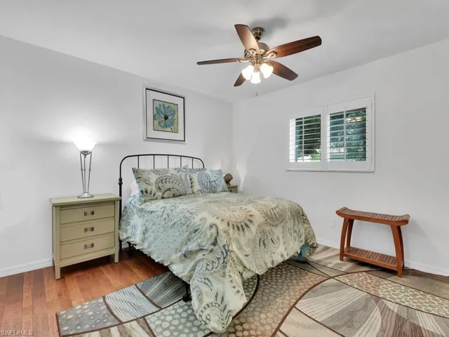 Bedroom featuring ceiling fan and light hardwood / wood-style flooring