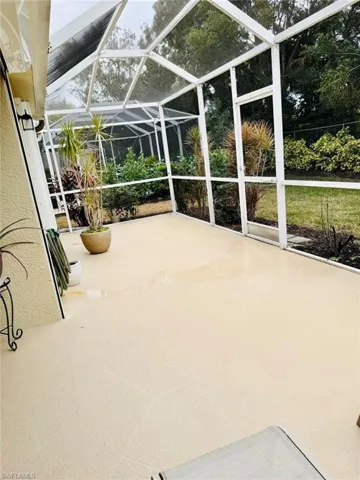 Unfurnished sunroom with a patio