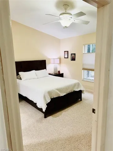 Bedroom with carpet floors and a ceiling fan