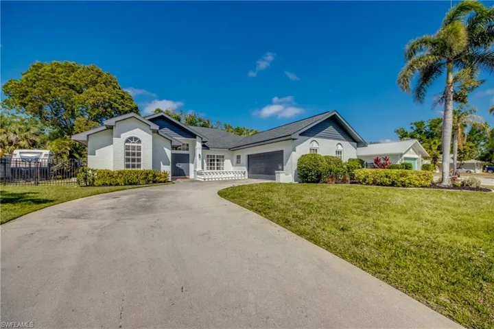 Long driveway leading to 2 car side loading garage