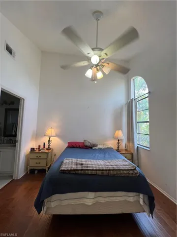 Bedroom featuring wood-type flooring and ceiling fan
