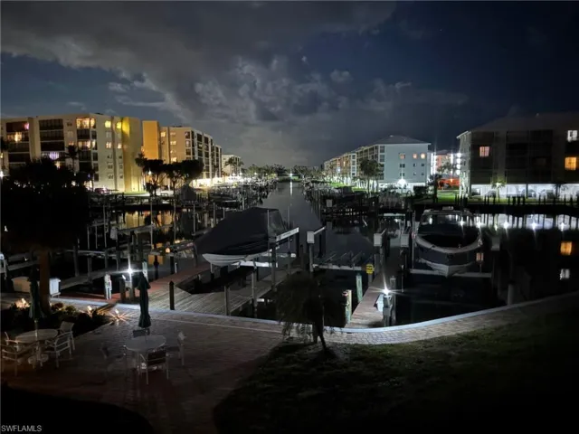 Dock featuring boat lift and a water view