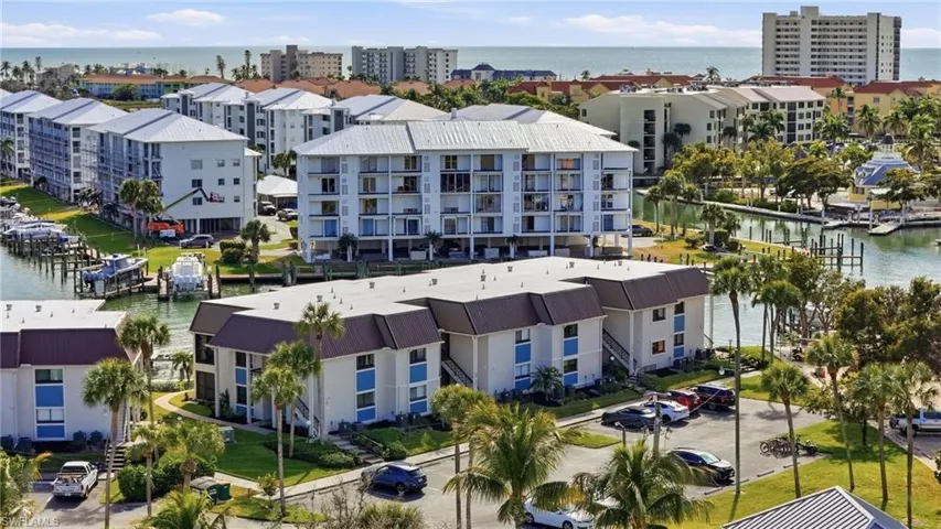Aerial view of  complex and a nearby body of water