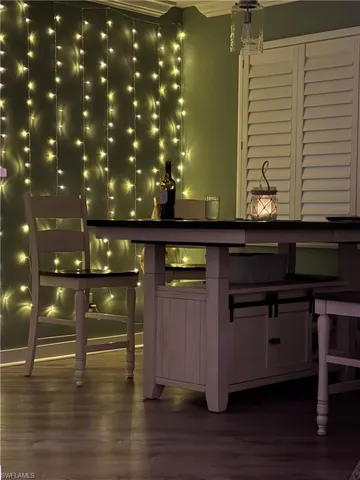 Bar area featuring dark wood-style floors