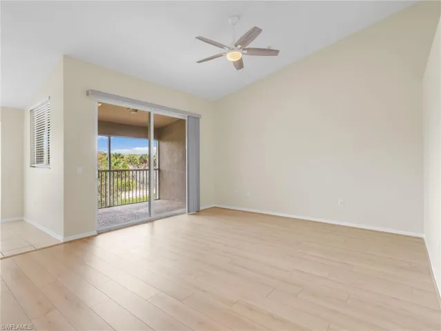 Great Room with Sliders Leading to Screened In Lanai with Landscaped View