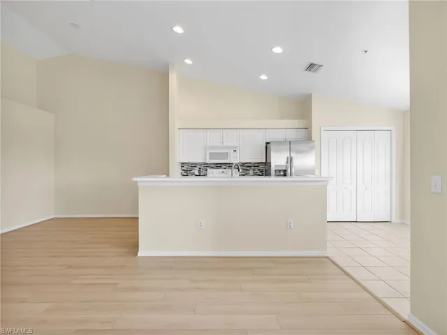 Kitchen with Island, Pantry, and Dining Room