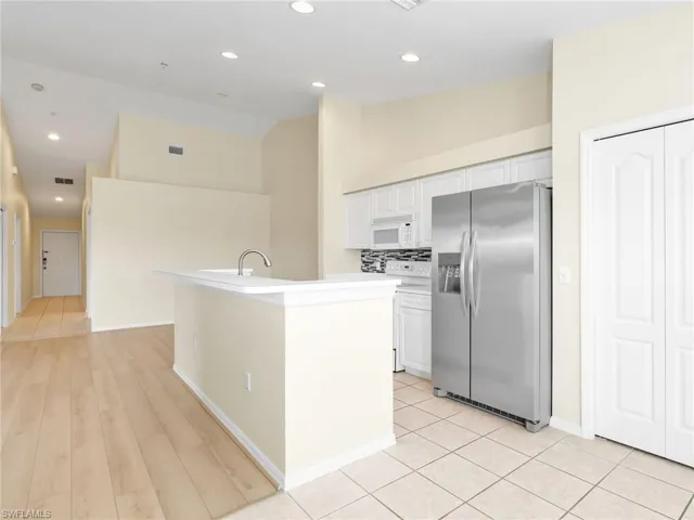 Kitchen with Island, Dining Room & Front Entry Hallway