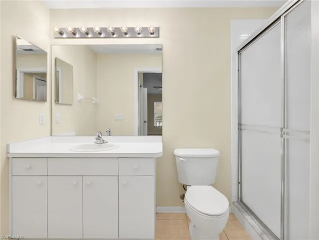 Primary Ensuite Bathroom with Tile Shower and Glass Shower Door Enclosure