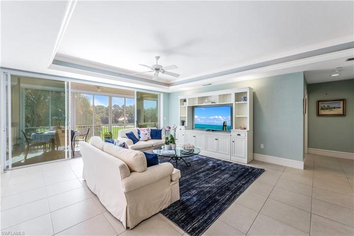 Living area has beautiful landscaped and golf course views.