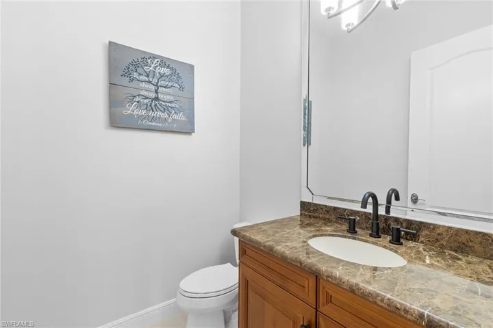 Bathroom with vanity and baseboards